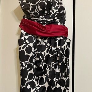 Dress worn for a wedding.  Has pockets and cummerbund.